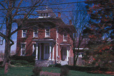 Red home with Italianate architecture